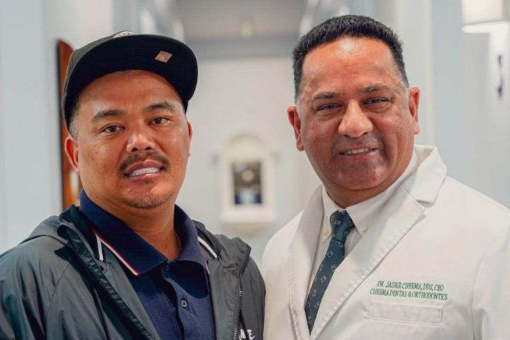 Dr Cheema with an implant dental patient