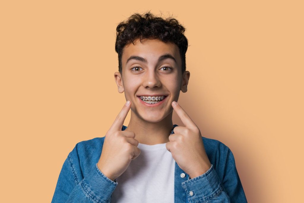 Teen Boy with metal braces smiling